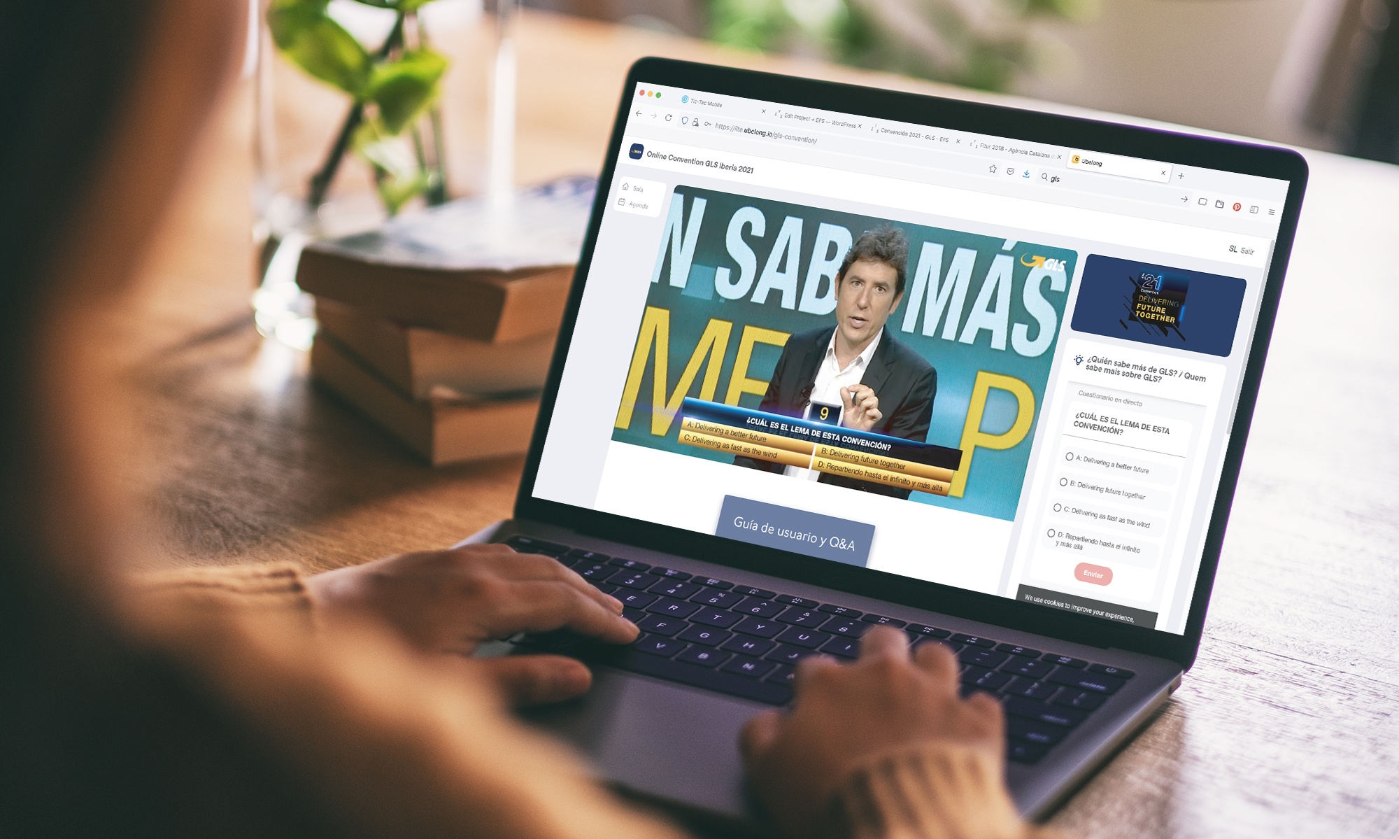 a woman using and typing on laptop with blank white desktop screen Mockup image of a woman using and typing on laptop with blank white desktop screen on wooden table